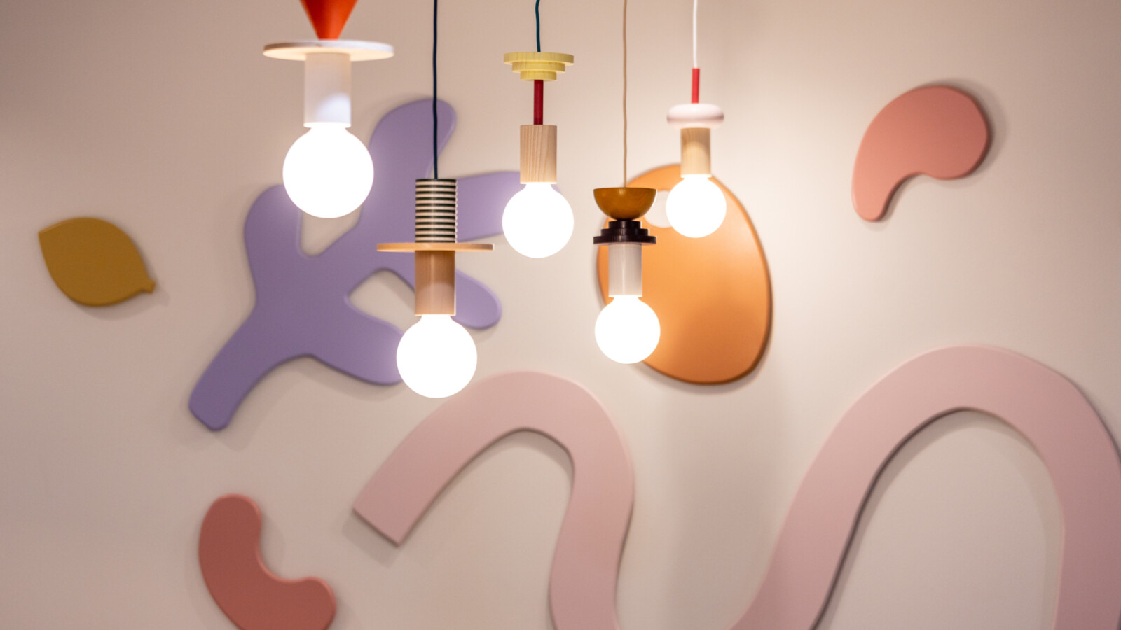 Custom wall artwork and playful light fittings