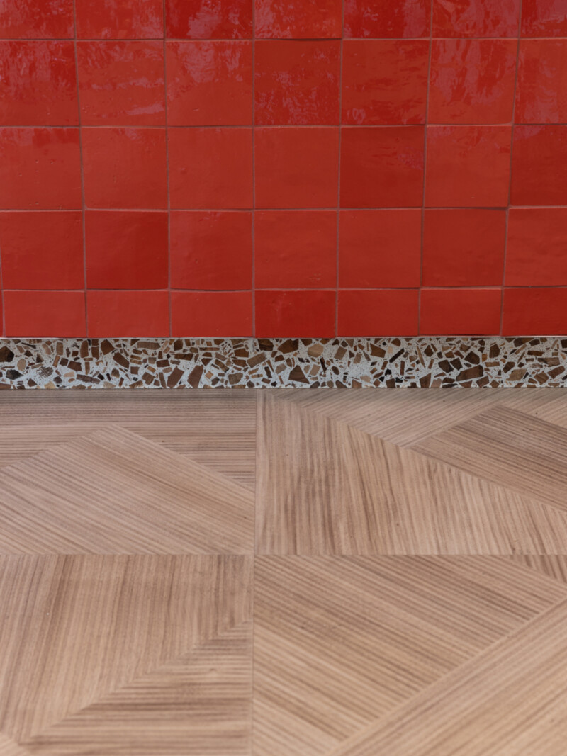 Red Zelige tile and recycled foresso edging detail at Runway Eaast Shoreditch