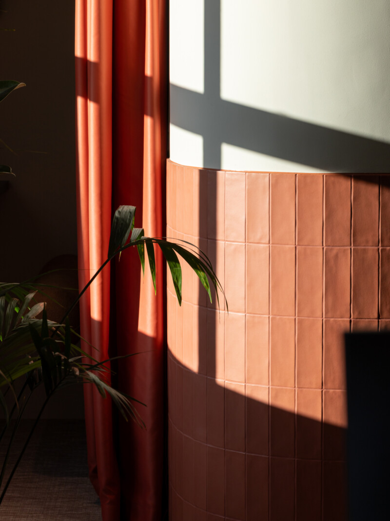 Terracotta wall tile detail with sunlight and shadow
