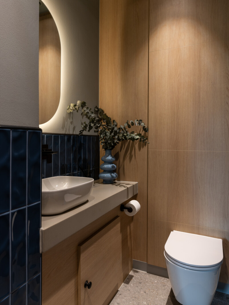 Bathroom details , tiling and sink, wood panel walls at TMT Group HQ