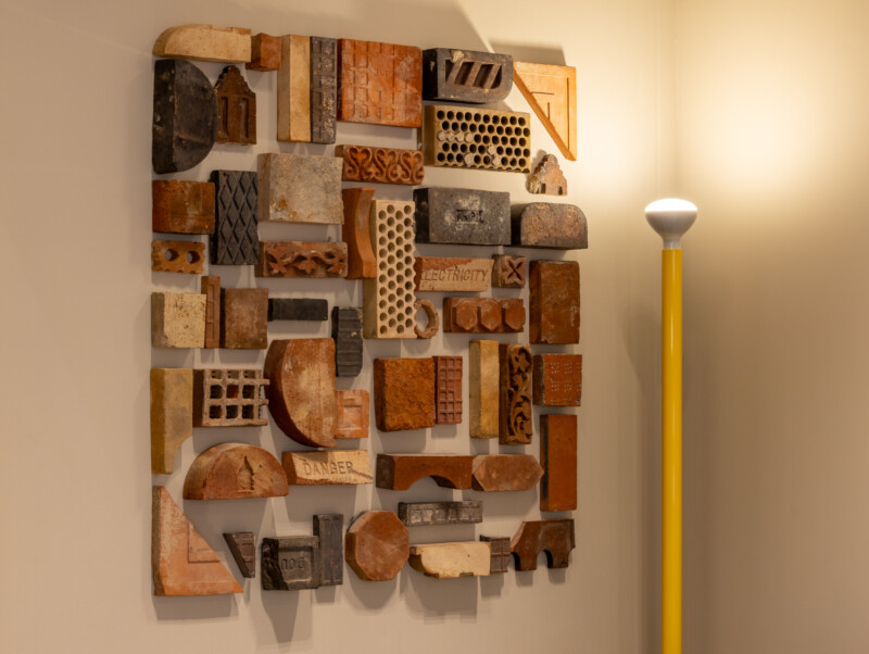 Wall art made from recycled construction materials at TMT Group HQ workspace