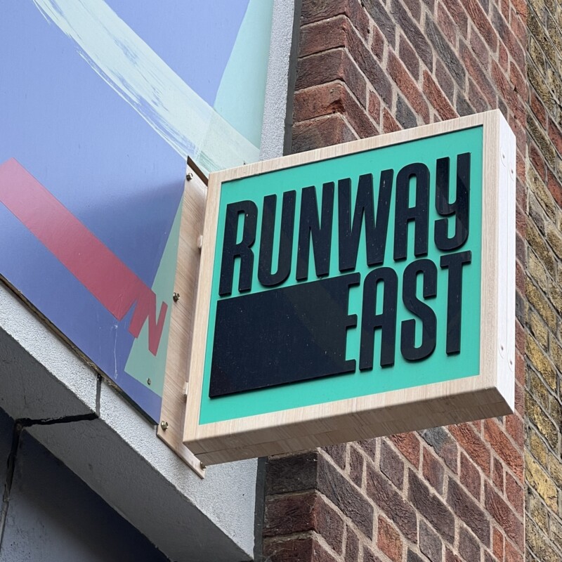 Custom designed external signage at Runway East London Bridge